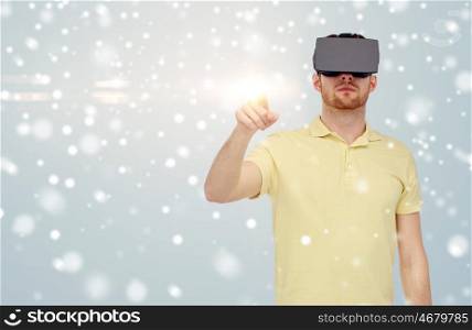 technology, augmented reality, winter, christmas and people concept - young man with virtual headset or 3d glasses playing game over gray background and snow