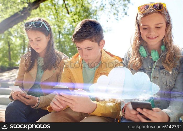 technology, cloud computing and people concept - group of happy teenage friends with smartphone and headphones outdoors. teenage friends with smartphone and headphones
