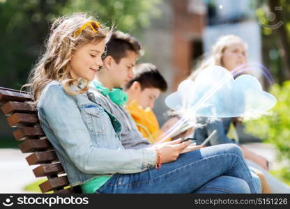 technology, cloud computing and people concept - happy girl with tablet pc computer and group of teenage friends or students outdoors. happy girl with tablet pc computer outdoors