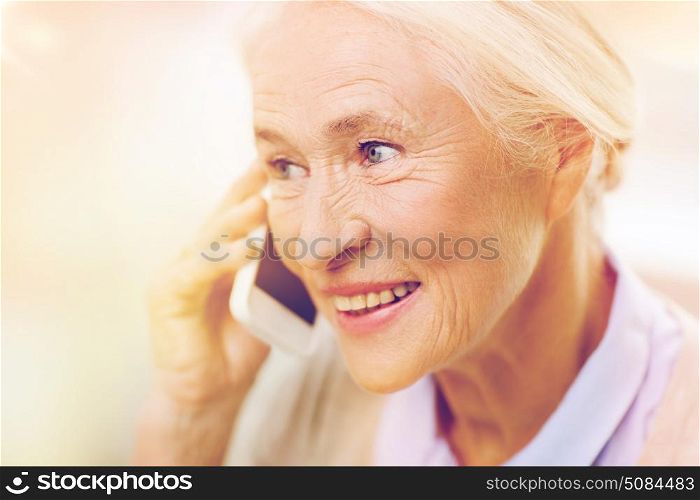 technology, communication age and people concept - happy senior woman with smartphone calling at home. senior woman with smartphone calling at home. senior woman with smartphone calling at home