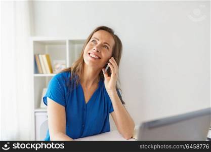 technology, communication and business concept - happy woman calling on smartphone at office or home. woman calling on smartphone at office or home