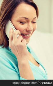 technology, communication and home concept - woman with smartphone computer at home