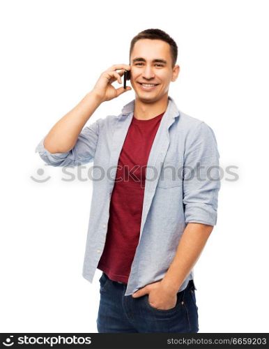 technology, communication and people concept - happy smiling young man calling on smartphone over white background. happy young man calling on smartphone