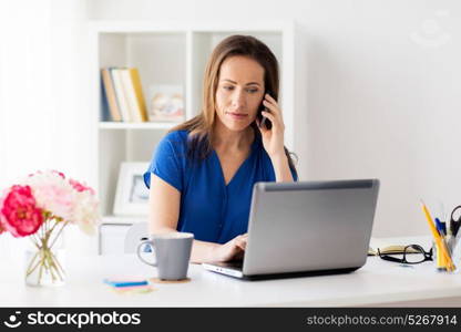 technology, communication and people concept - happy woman calling on smartphone at office or home. woman calling on smartphone at office or home