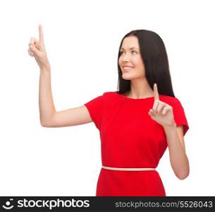 technology concept - attractive young woman in red dress working with virtual screen
