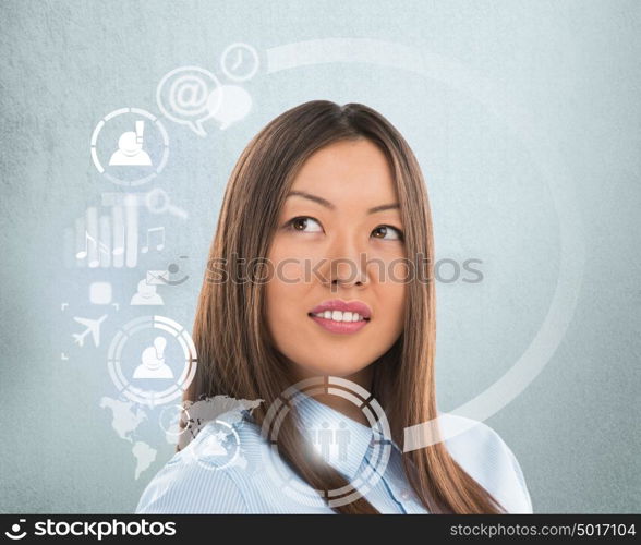 Technology concept. Businesswoman and virtual interface with web and social media icons