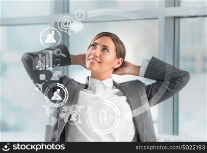 Technology concept. Businesswoman and virtual interface with web and social media icons