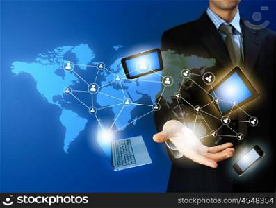 Technology concept. Image of business person holding devices in hands