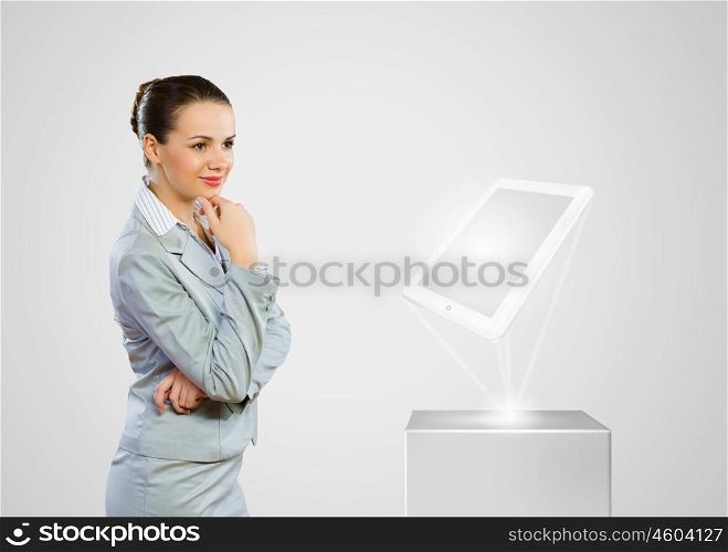 Technology concept. Image of businesswoman and white tablet pc. New technologies