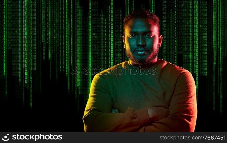 technology, cyberspace and programming concept - portrait of young african american man over binary code numbers on black background. young african american man over binary code