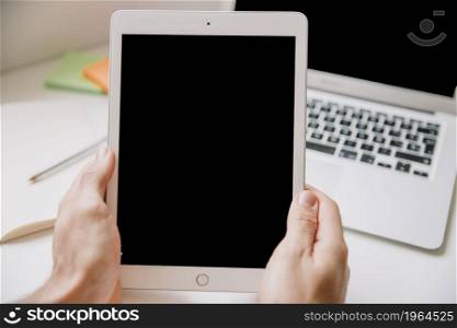 technology desk concept with hands holding tablet. High resolution photo. technology desk concept with hands holding tablet. High quality photo