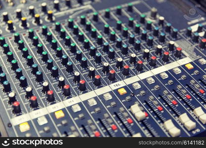 technology, electronics and equipment concept - control panel at recording studio or radio station