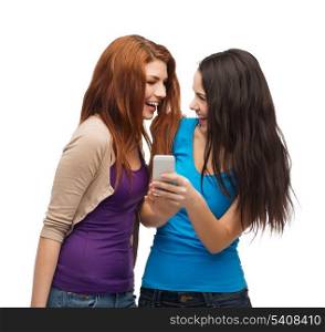 technology, friendship and people concept - two smiling teenagers with smartphone