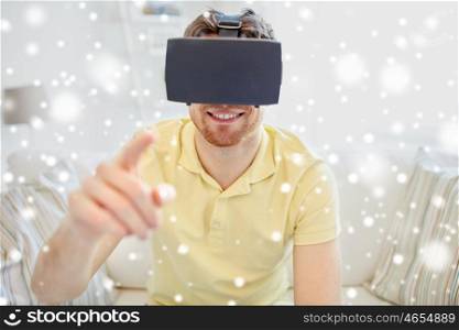 technology, gaming, augmented reality, entertainment and people concept - happy young man with virtual headset or 3d glasses playing video game