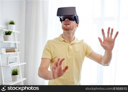 technology, gaming, entertainment and people concept - young man with virtual reality headset or 3d glasses playing video game