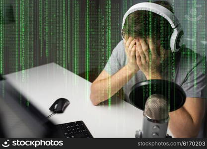 technology, gaming, entertainment, let&amp;#39;s play and people concept - close up of sad young man in headset with pc computer failed playing video game and streaming playthrough or walkthrough at home