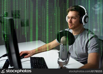 technology, gaming, entertainment, let&amp;#39;s play and people concept - young man in headset with pc computer playing game at home and streaming playthrough or walkthrough video