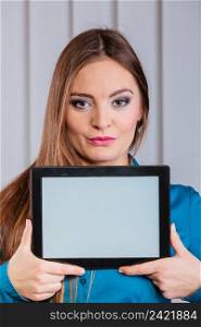 Technology help in career business and work advertisement. Young woman hold tablet portable computer show advice and help.. Woman in office present tablet notebook.