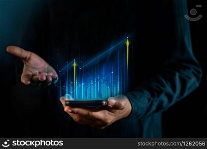 Technology, High Profit, Stock Market, Business Growth, Strategy Planing concept. a Man Presenting Graphs and Charts information on Smartphone