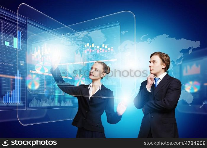 Technology innovations. Businessman and businesswoman touching icon of digital screen