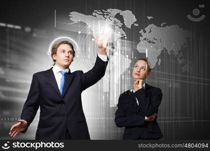 Technology innovations. Businessman and businesswoman touching icon of digital screen
