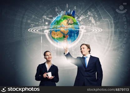 Technology innovations. Businessman and businesswoman touching icon of digital screen. Elements of this image are furnished by NASA