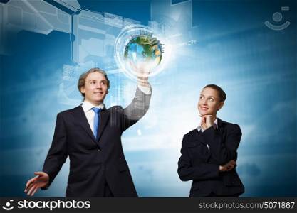 Technology innovations. Businessman and businesswoman touching icon of digital screen. Elements of this image are furnished by NASA