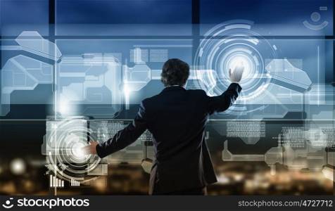Technology innovations. Businessman in suit against digital background with icons