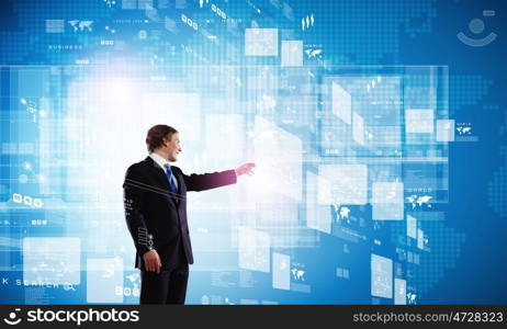 Technology innovations. Businessman in suit against digital background with icons