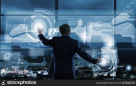 Technology innovations. Businessman in suit against digital background with icons