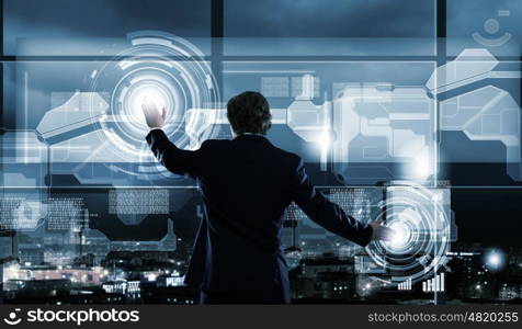 Technology innovations. Businessman in suit against digital background with icons