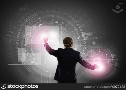 Technology innovations. Businessman in suit against digital background with icons