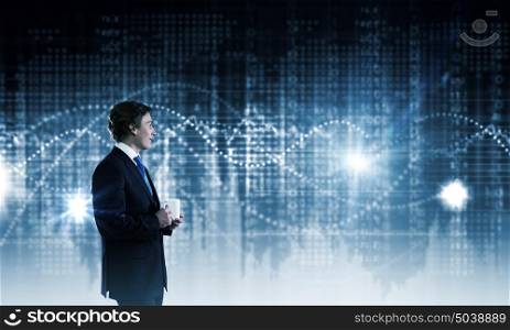Technology innovations. Businessman in suit against digital background with icons