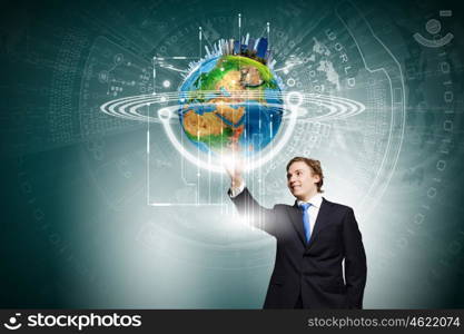 Technology innovations. Businessman in suit touching icon of media screen. Elements of this image are furnished by NASA