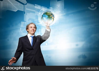 Technology innovations. Businessman in suit touching icon of media screen. Elements of this image are furnished by NASA