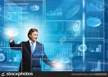 Technology innovations. Businessman in suit touching icon of media screen