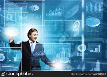 Technology innovations. Businessman in suit touching icon of media screen