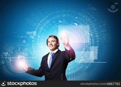 Technology innovations. Businessman in suit touching icon of media screen