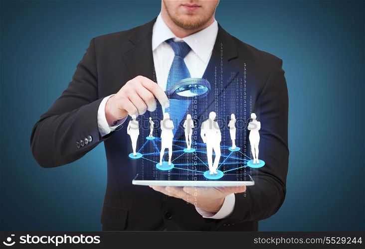 technology, internet and business concept - businessman holding magnifying glass over tablet pc and looking at social or business network