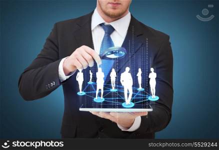 technology, internet and business concept - businessman holding magnifying glass over tablet pc and looking at social or business network