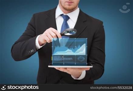 technology, internet and business concept - businessman holding magnifying glass over tablet pc computer with growing chart