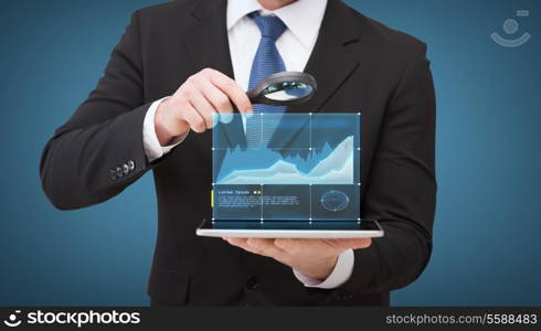 technology, internet and business concept - businessman holding magnifying glass over tablet pc computer