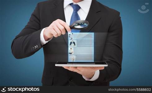 technology, internet and business concept - businessman holding magnifying glass over tablet pc computer