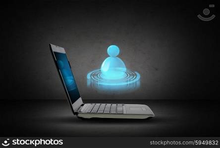 technology, internet and communication concept - open laptop computer with internet contact icon projection over dark gray background
