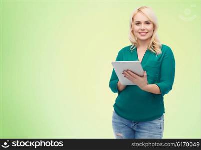 technology, internet and people concept concept - smiling woman with tablet pc computer over green natural background