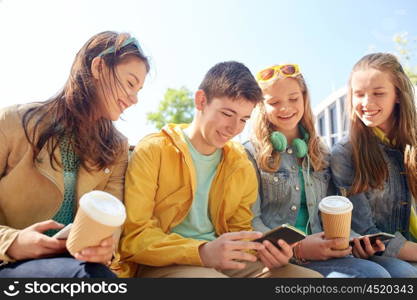 technology, internet and people concept - group of happy teenage friends with smartphone and coffee cups outdoors