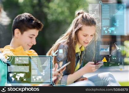 technology, internet and people concept - happy teenage boy with tablet pc computer and girl with smartphone outdoors. happy teenage friends with gadgets outdoors. happy teenage friends with gadgets outdoors