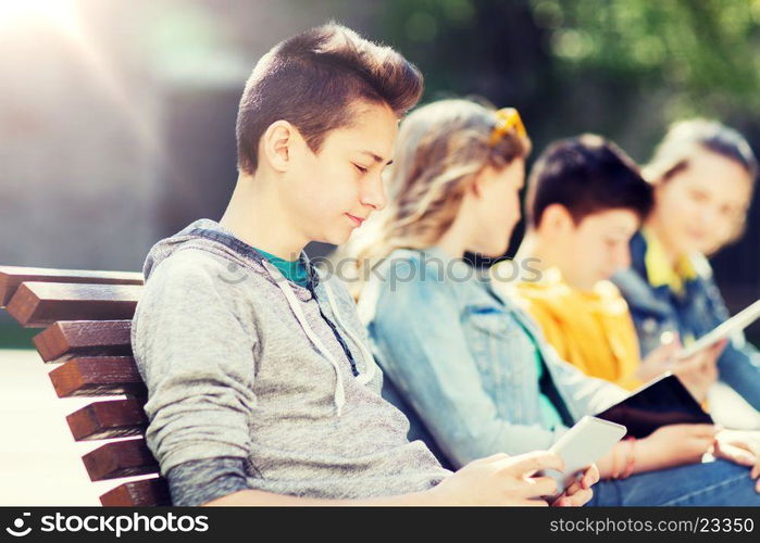 technology, internet and people concept - happy teenage boy with tablet pc computer outdoors. happy teenage boy with tablet pc computer outdoors. happy teenage boy with tablet pc computer outdoors