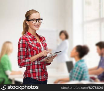 technology, internet and people concept - smiling girl in eyeglasses with tablet pc computer