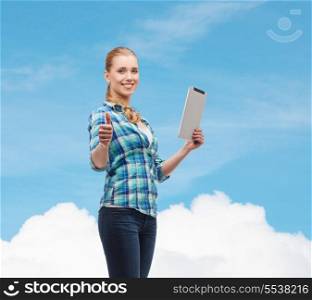 technology, internet and people concept - smiling girl with tablet pc computer showing thumbs up